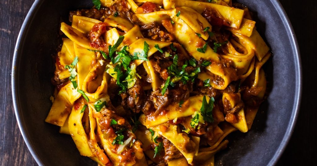 Oil refinery at night — geopolitical tensions in the Middle East